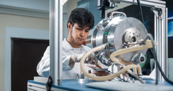 An engineer preparing a CVD reactor chamber