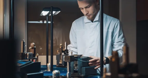 An engineer at a diamond polishing machine