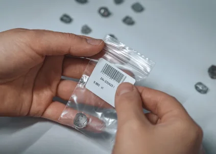 Grown diamond crystals packed in a labelled batch bag
